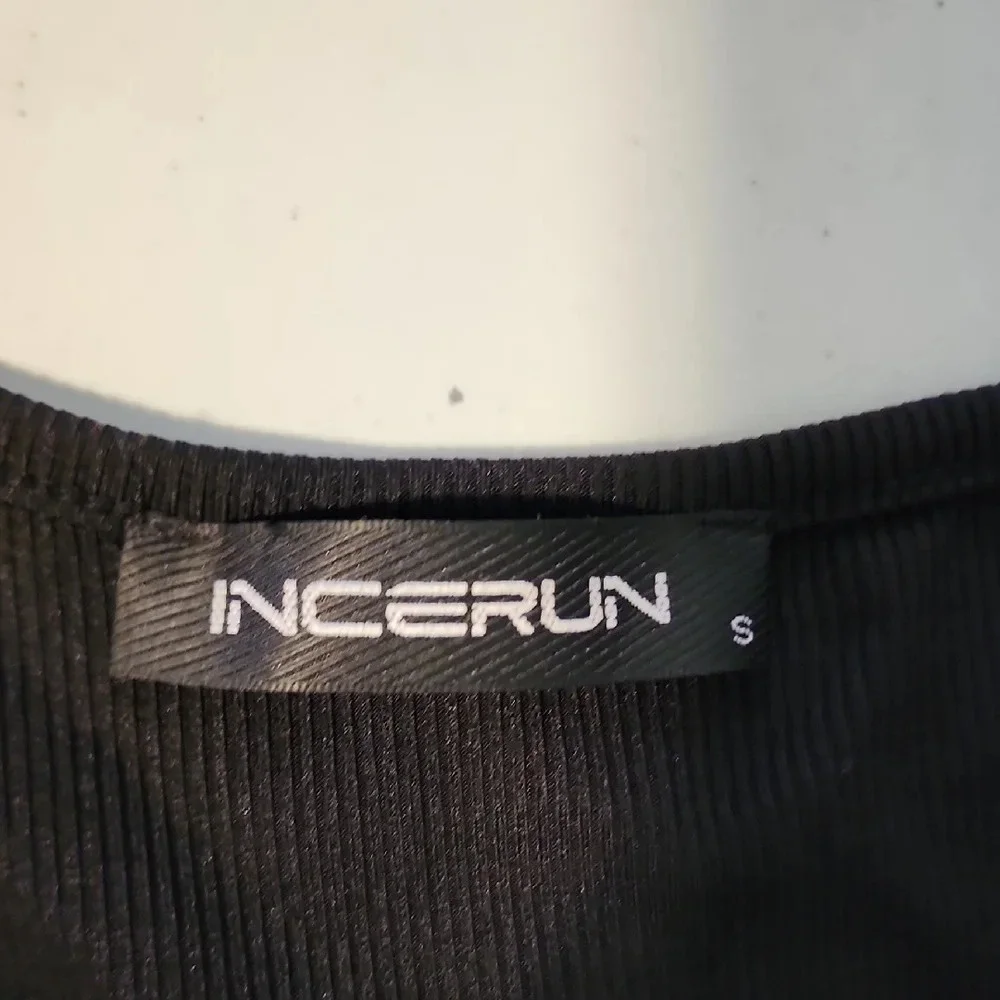 Black Tank Top with Ribbed Texture and Buckle Accents - Picture 2 of 6